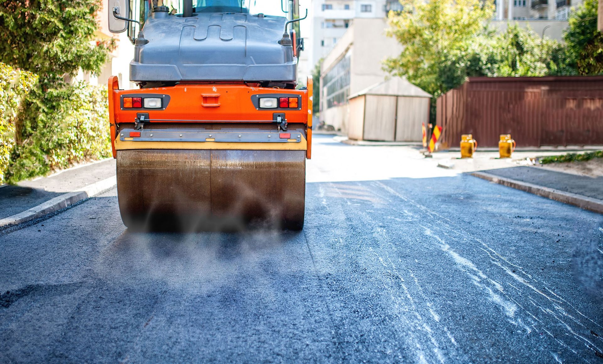 J&S Paving crew preparing a fresh asphalt surface
